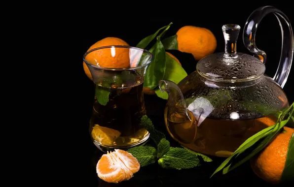 Tea, kettle, black background, tangerines
