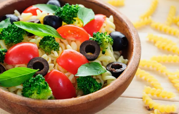 Greens, tomatoes, olives, pasta dish