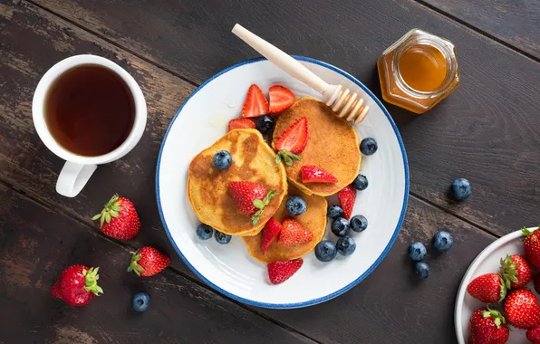 Berries, honey, pancakes