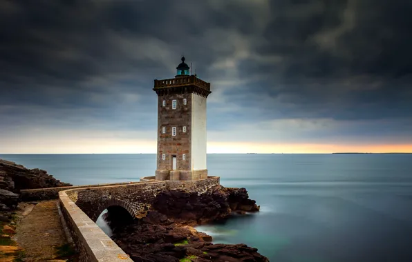 Sea, clouds, stones, lighthouse, Brittany