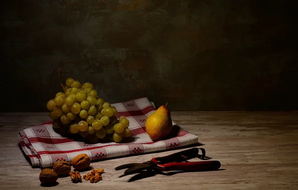 The dark background, table, Board, towel, grapes, pear, fruit, nuts