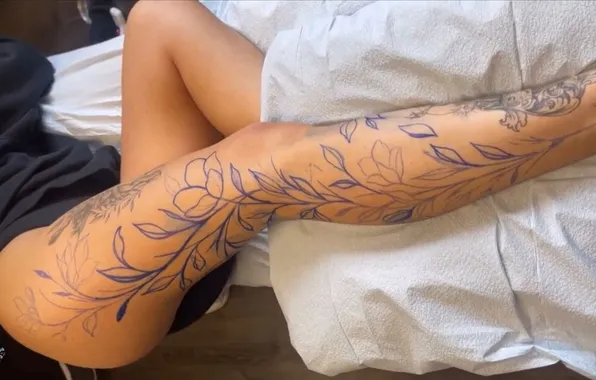 Girl, tattoo, bed, tattoo on the leg