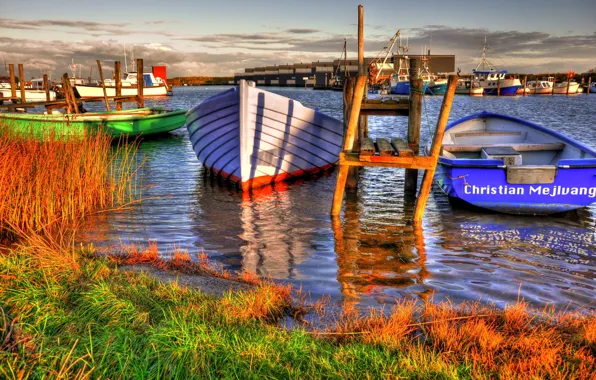 The sky, grass, water, clouds, shore, boat, home, pier