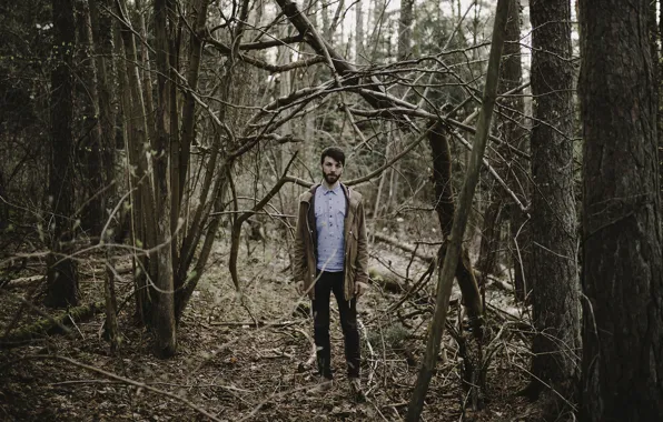 Picture forest, trees, man, branches, jacket, beard, direct gaze