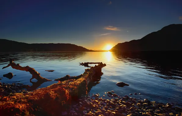 The sky, water, the sun, light, sunset, mountains, pebbles, lake