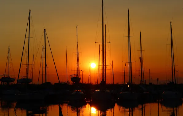 Picture the sun, sunset, yachts, silhouettes