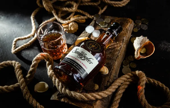The dark background, table, wine, glass, bottle, money, rope, shell