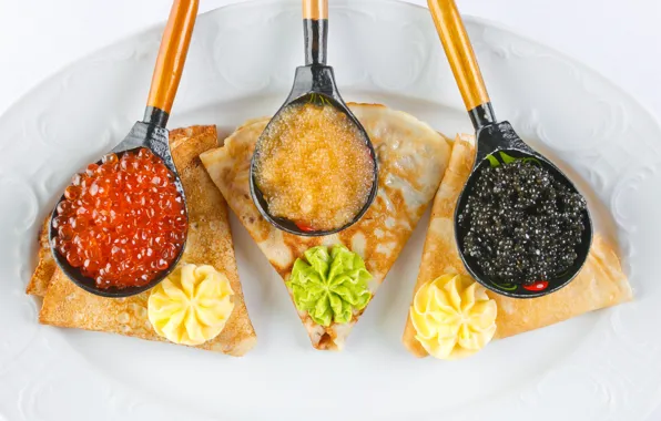 Pancakes, caviar, spoon