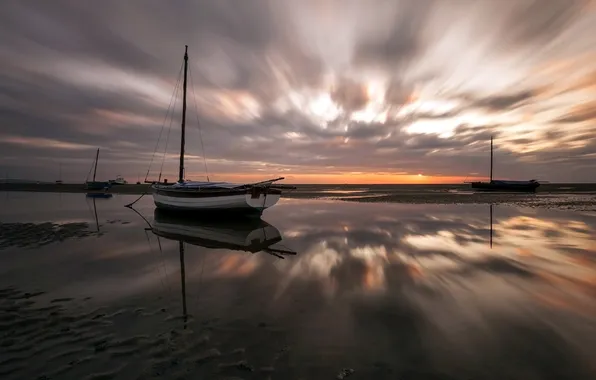 Sea, sunset, boats, stranded