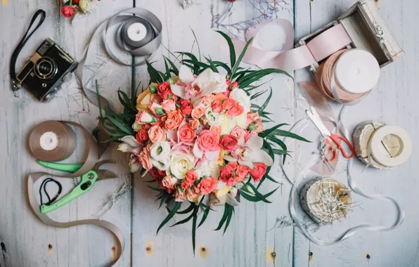Picture needles, bouquet, the camera, tape, scissors, wooden background, floral