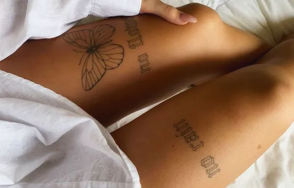 Girl, slender legs, tattoos on the legs, butterfly tattoo