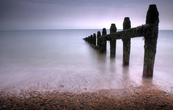 Picture sea, the sky, stones, beams