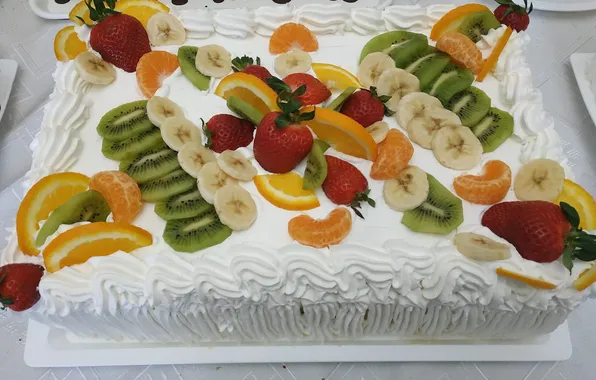Orange, banana, strawberries, fruit cake