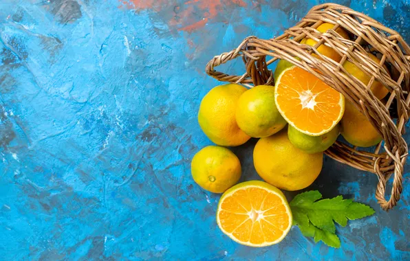 Leaves, fruit, basket, halves, blue background, composition, tangerines