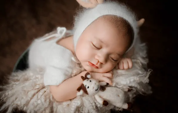 Close-up, pose, the dark background, background, toy, child, sleep, cow