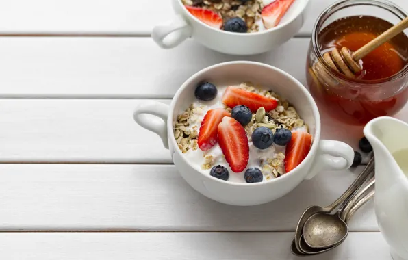 Picture berries, blueberries, strawberry, honey, spoon, yogurt, oatmeal