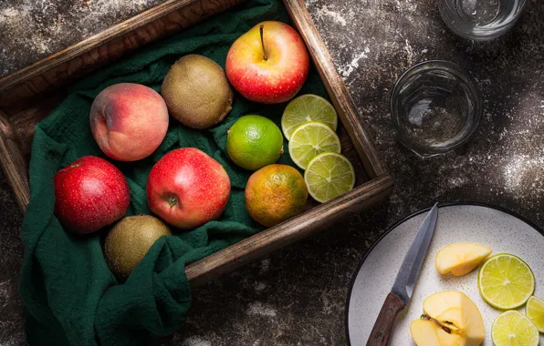 Table, apples, towel, kiwi, plate, knife, fabric, lime