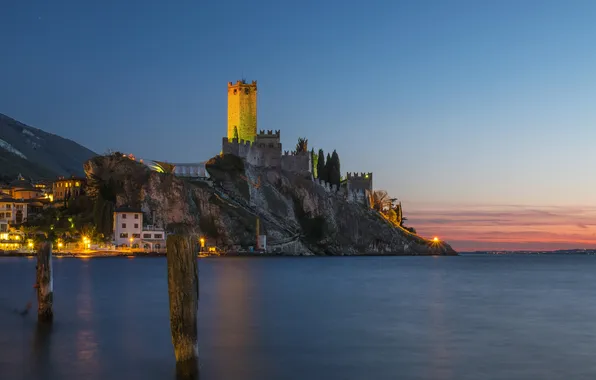 Picture the sky, sunset, night, lights, rock, lake, castle, shore