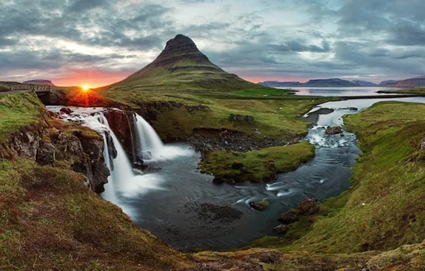 Picture the sky, the sun, rays, sunset, bridge, river, mountain, waterfall