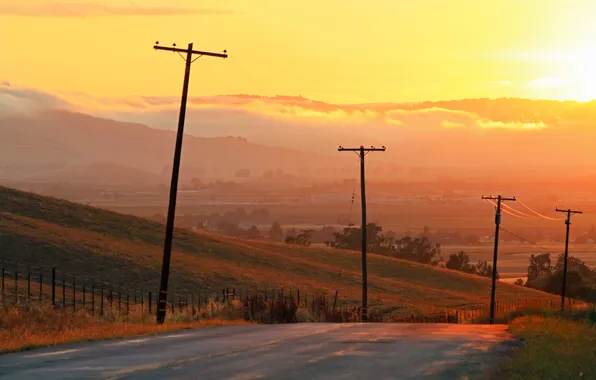 Road, field, clouds, sunset, the fence, valley, power line, yellow sky