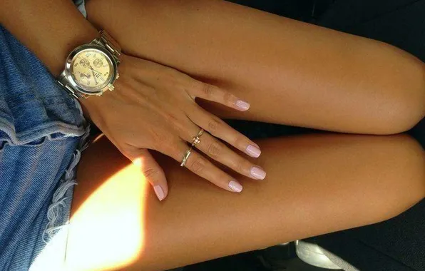 Girl, watch, tan, ring, manicure, slender legs, denim shorts