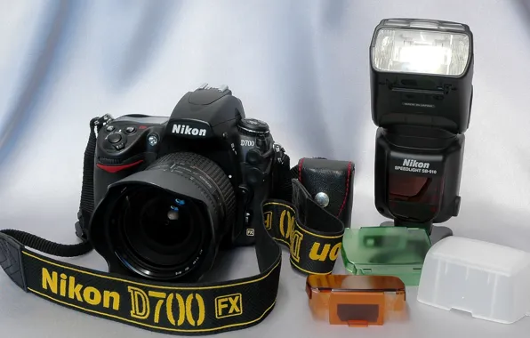 Picture background, the camera, strap, mirror, Nikon D-700 FX, flash Nikon Speedlight SB-910, lens AF Nikkor …