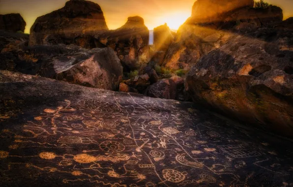 Picture the sun, rays, stones, rocks, drawings