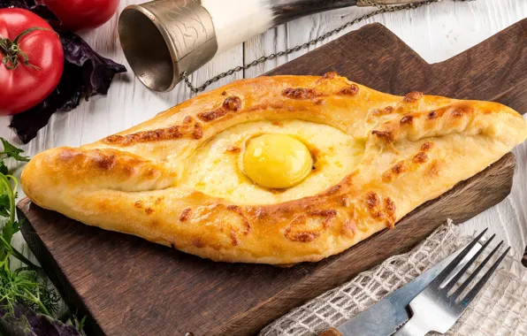 Eggs, tomatoes, spices, khachapuri