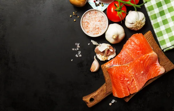 Fish, black background, tomatoes, garlic, salt, salmon