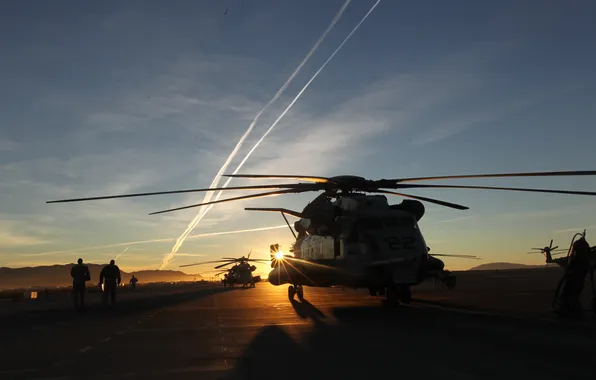 Sunset, people, helicopters, the airfield