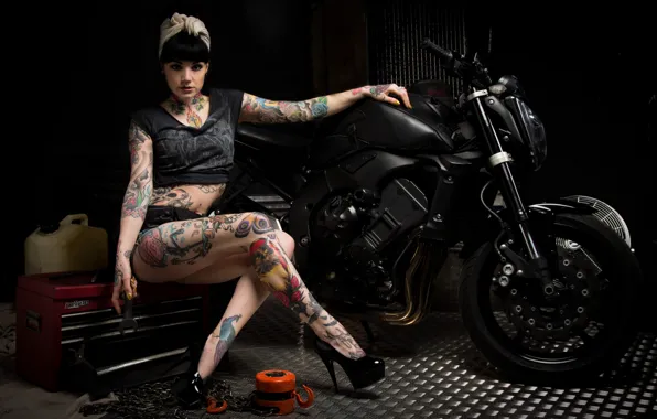 Picture woman, motorcycle, tattoos, tools