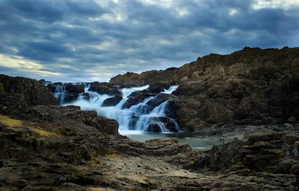 Stream, stones, waterfall, gray clouds