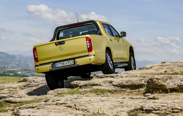 Picture the sky, clouds, mountains, yellow, rocks, vegetation, Mercedes-Benz, pickup