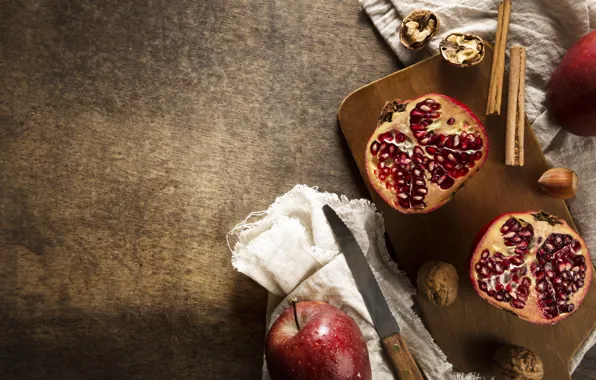 Grenades, brown background, pomegranate grains