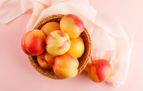 Fabric, bowl, fruit, peaches, pink background, network, the view from the top, composition