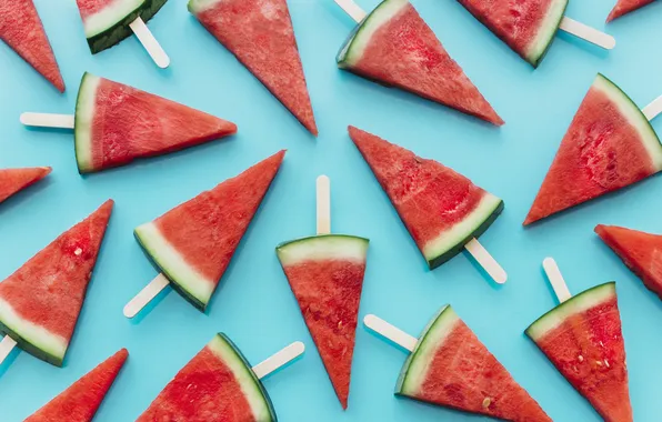 Watermelon, a lot, slices, blue background, slices, on a stick