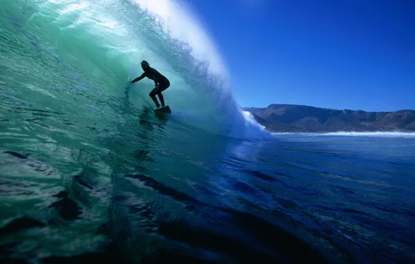 Picture the ocean, wave, surfer