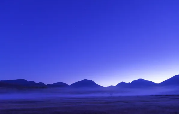 Picture field, the sky, mountains, fog, the evening