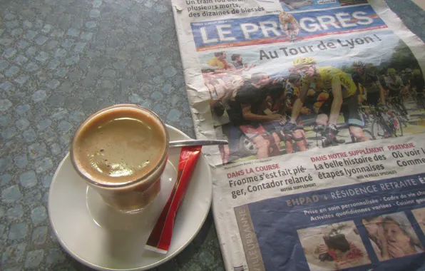 Coffee, newspaper, sugar, spoon