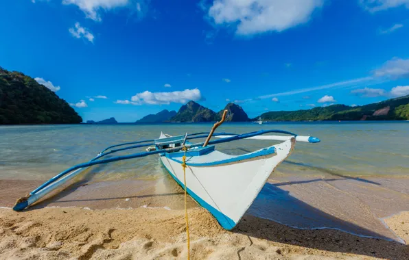 Sand, sea, the sky, the sun, clouds, mountains, tropics, shore
