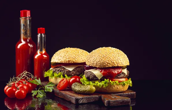 Picture bottle, black background, hamburger, ketchup, cucumbers