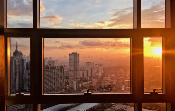 Picture the sky, the sun, clouds, sunset, the city, building, horizon, glow