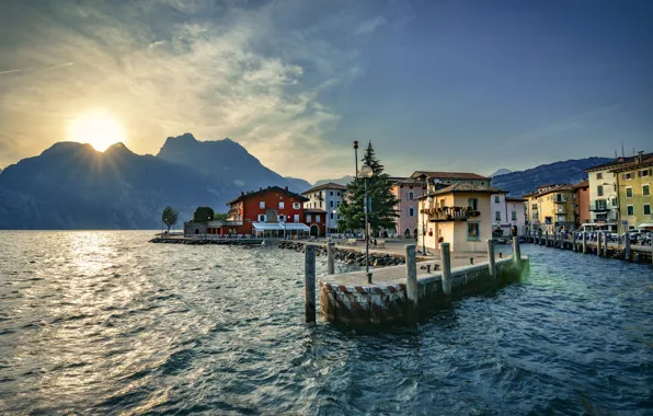 Picture the sun, rays, landscape, mountains, lake, home, pier, Italy, promenade, Garda