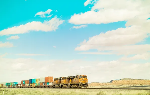 Picture the sky, clouds, train, hill, containers, train