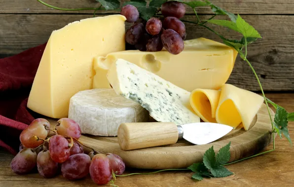 Cheese, grapes, knife, mold