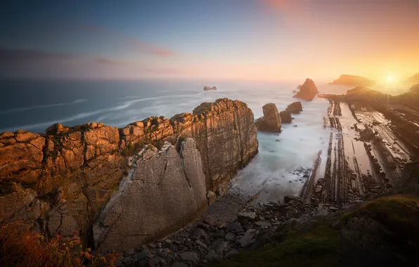 Sea, the sky, the sun, rocks, shore