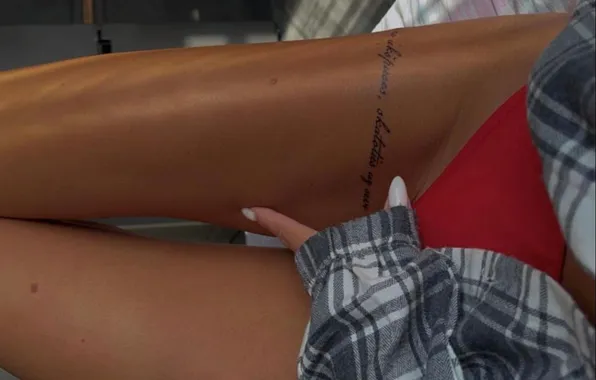 Girl, tattoo, manicure, red panties, slender legs, tattoo on the leg
