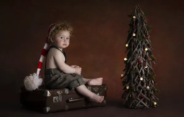 Picture look, holiday, new year, barefoot, boy, baby, suitcase, tree