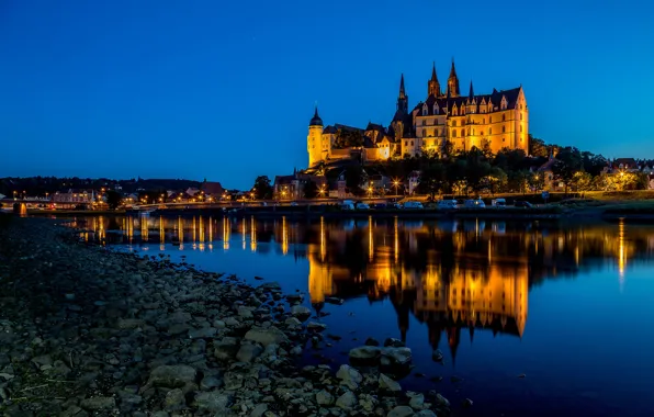 Picture the sky, trees, lights, river, stones, castle, shore, home