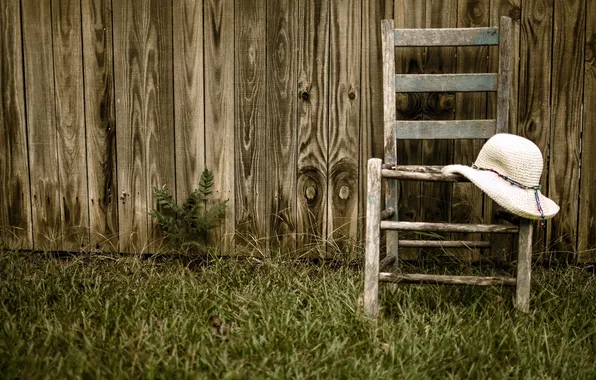 The fence, chair, hat